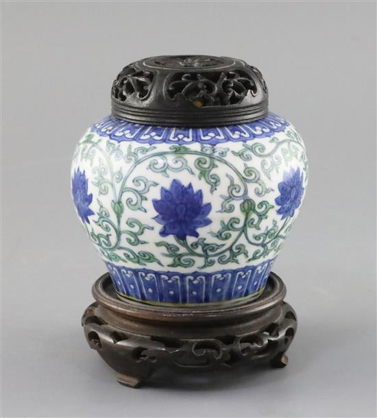 A rare Chinese doucai lotus flower jar, Wanli six character mark and probably of the period, (1573-1619), H. 9.5cm, D. 10.8cm, later